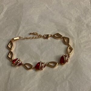 Elegant Gold Bracelet with Red Accents